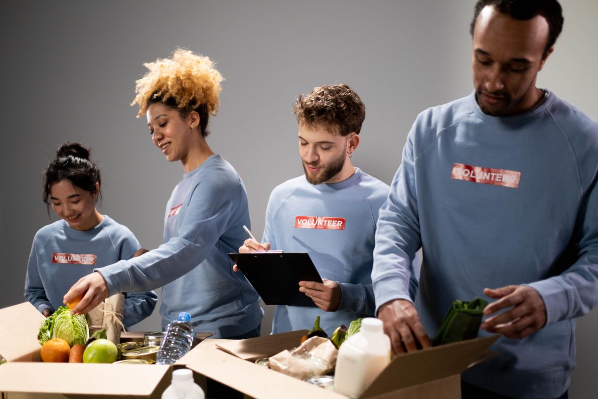 Volunteers working together to pack food donations