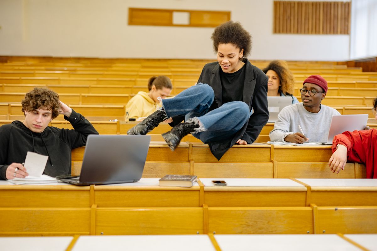 Students settling into a shared university lecture room